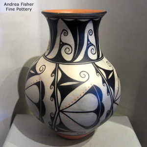 Black and white corn flower, water and geometric design on a polychrome jar