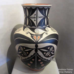 Corn, cotton, moth and geometric design on a polychrome jar