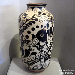 fish and geometric design on a tall polychrome jar