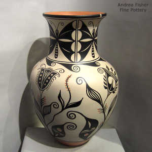 Cotton, moth, water and geometric design on a polychrome jar