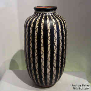 Black and white geometric design on a tall polychrome jar