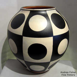 Black and white geometric design on a polychrome jar