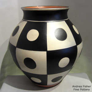 Black and white geometric design on a polychrome jar