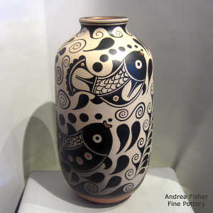 Fish, water and geometric design on a tall polychrome jar