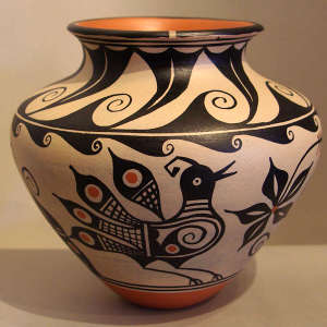Water, bird and geometric design on a low shoulder polychrome jar