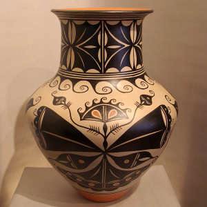 Butterfly, corn flower and geometric design on a large polychrome jar