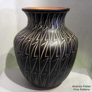 Black and white geometric design on a polychrome jar
