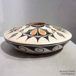 A water, flower and geometric design on a polychrome jar