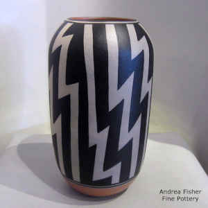 Black and white lightning bolt geometric design on a polychrome jar
