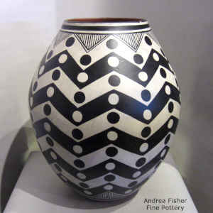 Black and white lightning bolt and rain drop design on a polychrome jar