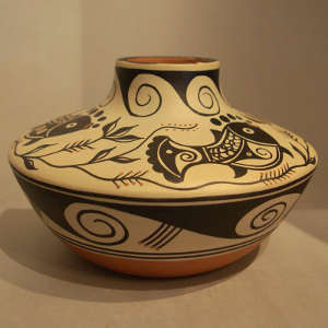 Fish, floral and geometric design on a polychrome jar