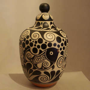 Fish and geometric design on a lidded polychrome jar