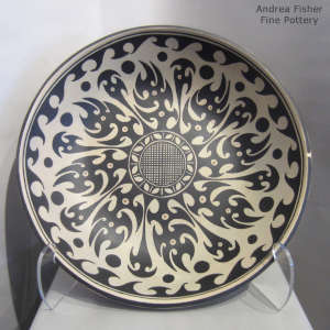 Geometric design inside and out on this large polychrome bowl