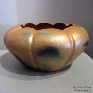 Fire clouds on a formed golden micaceous melon jar