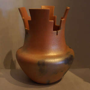 A prayer bowl in red and gold micaceous clay with fire clouds