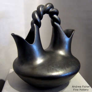 Fire clouds on a black micaceous wedding vase