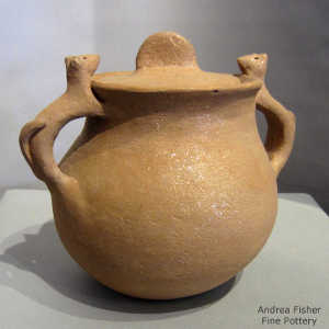 Animal handles on a lidded golden micaceous jar