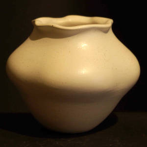 Pie crust rim on a micaceous white jar