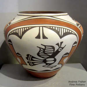Bird, cloud, rainbow and geometric design on a polychrome jar