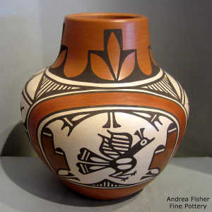 Roadrunner, rainbow, cloud and geometric design on a polychrome jar