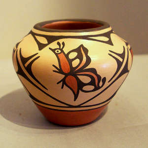 Butterfly and geometric design on a small polychrome jar