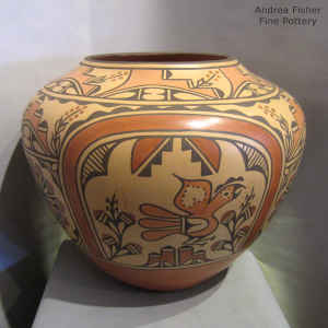 Roadrunner, cloud, rainbow, corn plant, medallion and geometric design on a polychrome jar