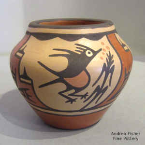 Bird, rain cloud and geometric design on a polychrome jar