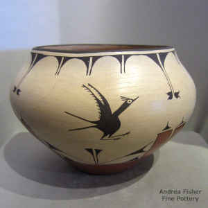 Bird, cloud and geometric design on a polychrome jar