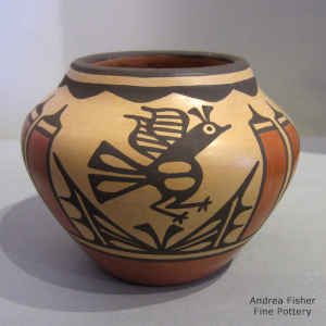 Bird, rain cloud and geometric design on a polychrome jar
