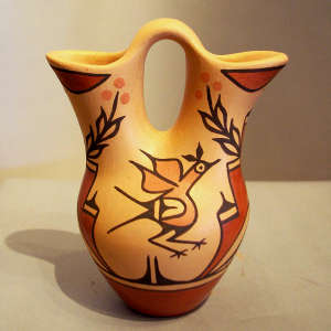Roadrunner, yucca and geometric design on a polychrome wedding vase