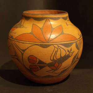 Bird and geometric design on a polychrome storage jar
