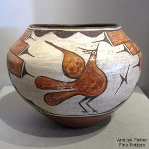 Bird, raincloud and geometric design on a polychrome jar