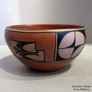 Polished inside and geometric design outside on a polychrome bowl