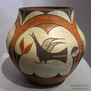 Bird, rainbow, cloud and geometric design on a polychrome jar