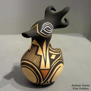 Bird element and geometric design on a small polychromeduck pot