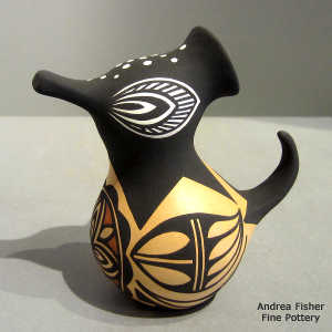 Rosette and bird element design on a small polychrome duck pot