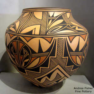 Cloud, rain, kiva step and traditional Zuni geometric design on a large polychrome jar
