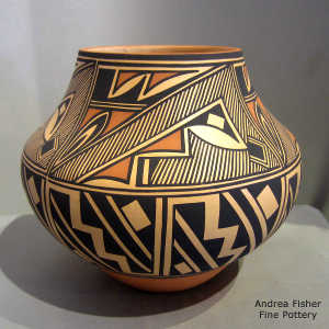 Kiva step, rain and geometric design on a polychrome jar