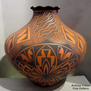 Spiral, kiva step, rain and geometric design on a black on orange jar with a pie crust rim