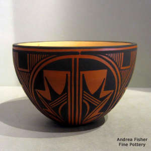 Traditional and contemporary geometric design in black on a red bowl