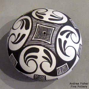Kiva step and geometric design on a black and white seed pot