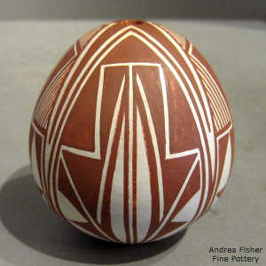 Fine line and geometric design on a brown and white seed pot