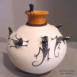 Lizard appliques all over a polychrome jar with a rolled lip