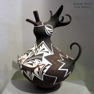Deer, heart line and geometric design on a polychrome duck pot