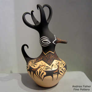 Deer, heart line and geometric design on a polychrome duck pot