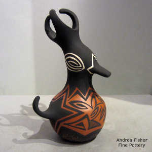 Geometric design on a black on red duck pot