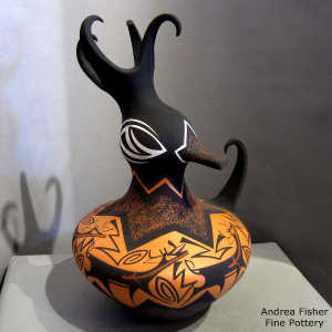 Deer, heart line and geometric design on a polychrome duck pot