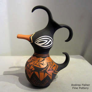 Deer, heart line and geometric design on a polychrome duck pot