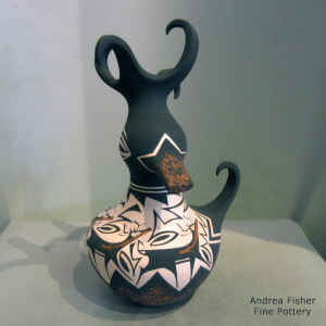 Deer, heart line and geometric design on a polychrome parrot pot