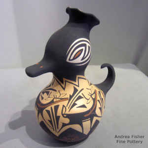 Deer, heart line and geometric design on a small polychrome duck pot
